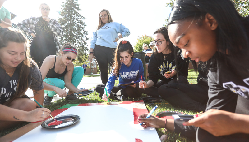 Students painting spirit boards