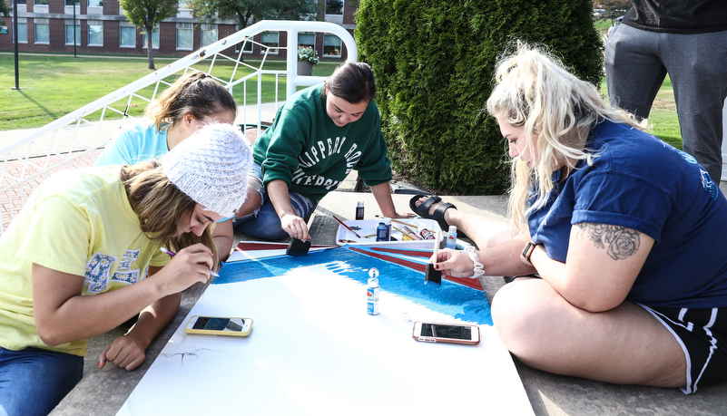 Students painting spirit boards