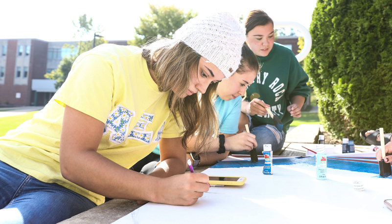 Students painting spirit boards