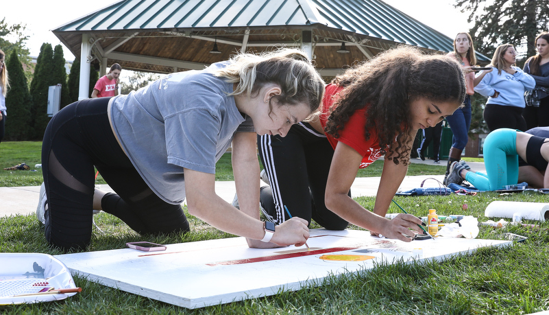 Students painting spirit boards