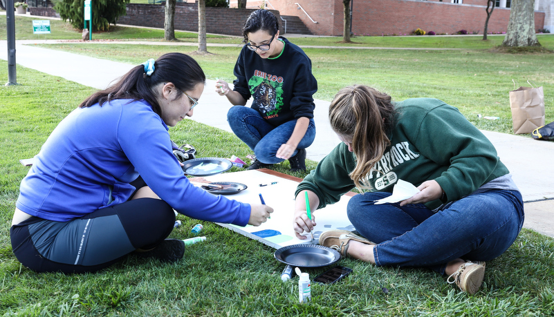 Students painting spirit boards