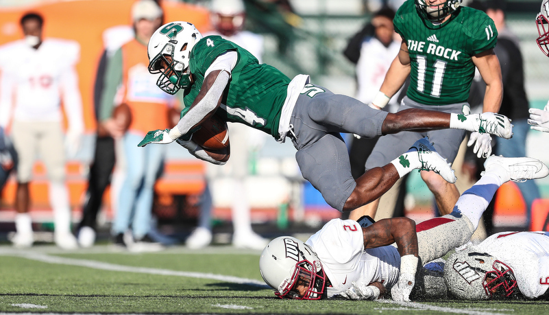 Running Back dives for a first down