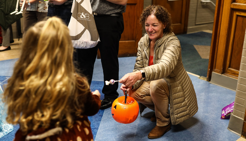 university staff passing out candy