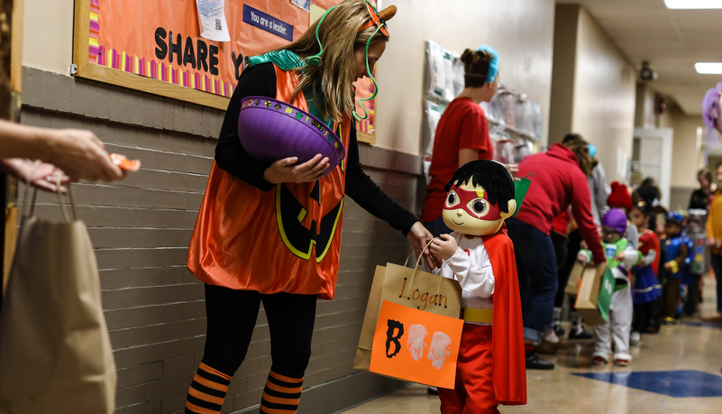 university staff handing out candy