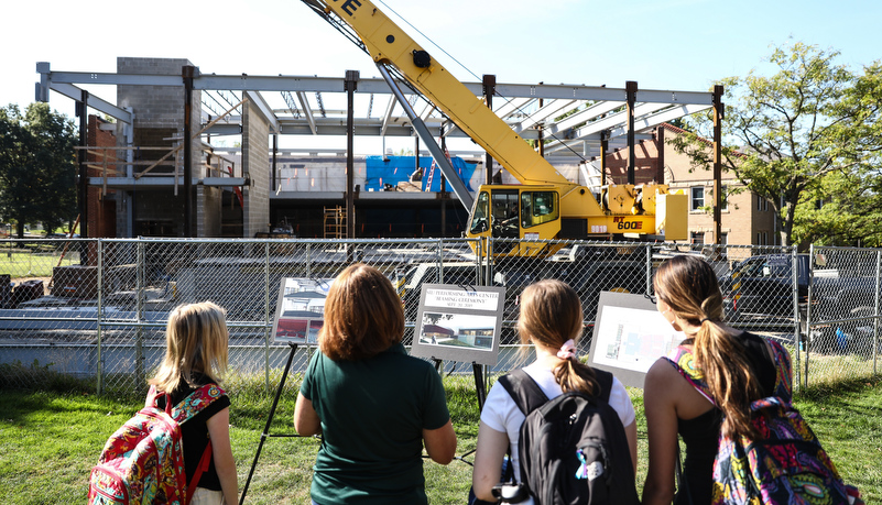 people looking at the construction site