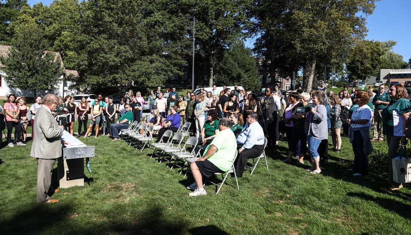 the crowd waits to sign the beam