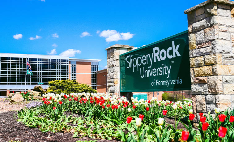 University sign with flowers