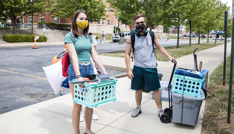 Two students getting ready to move in