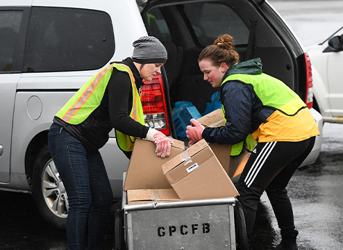 Genter helping load food