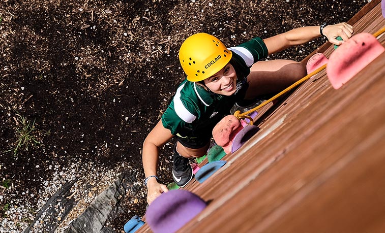 Student climbing wall