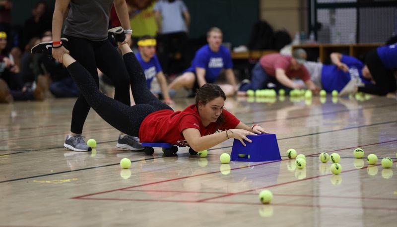 Students playing game in gym