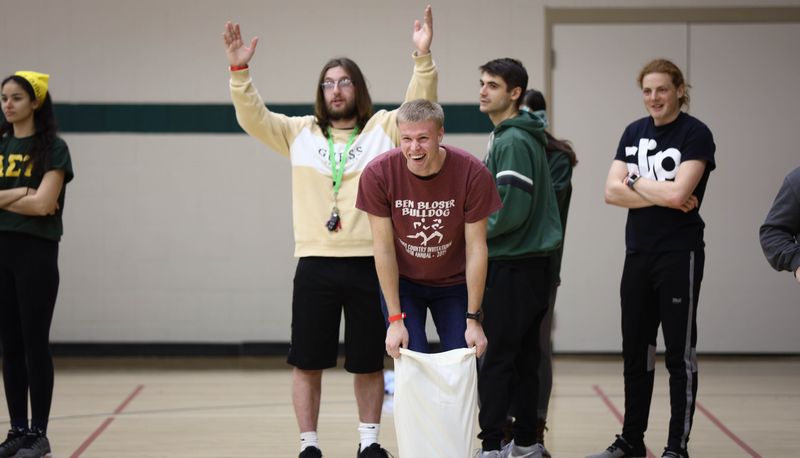 Group of students preparing for a sack-race