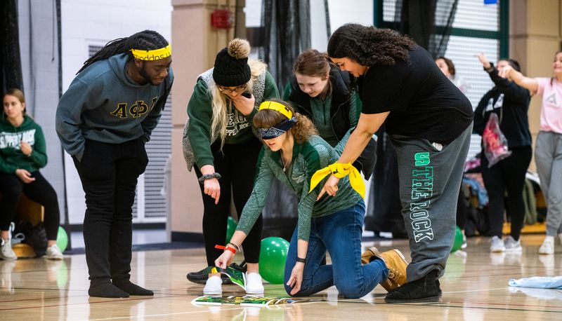 Friends cooperating in a blindfolded touch-based game