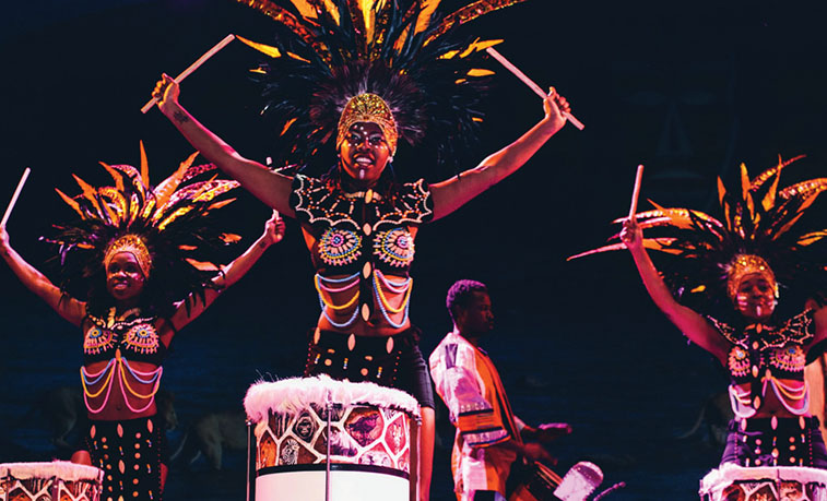 Performers playing the drums
