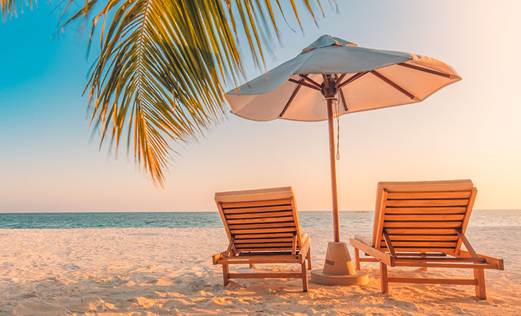 Beach chairs beside the ocean
