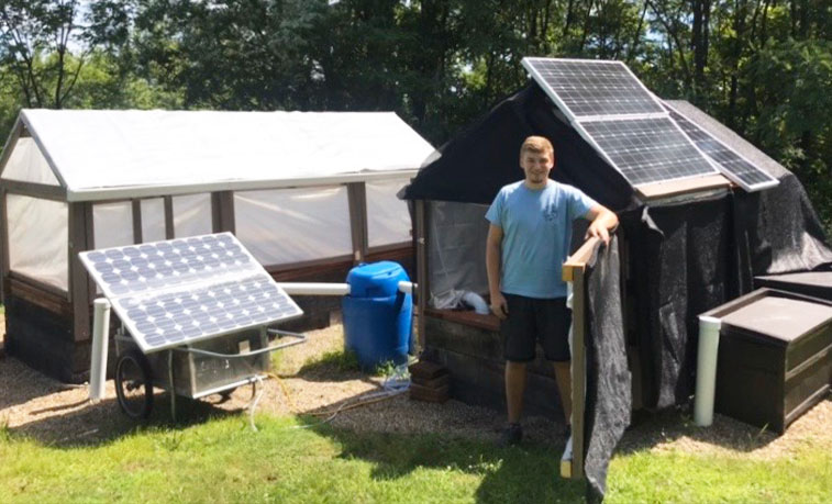 Student at the aquaponics site