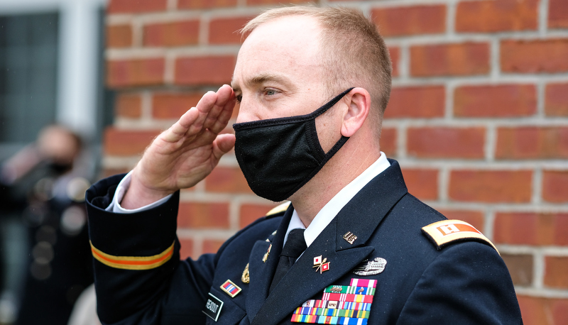 Captain Readout salutes the flag