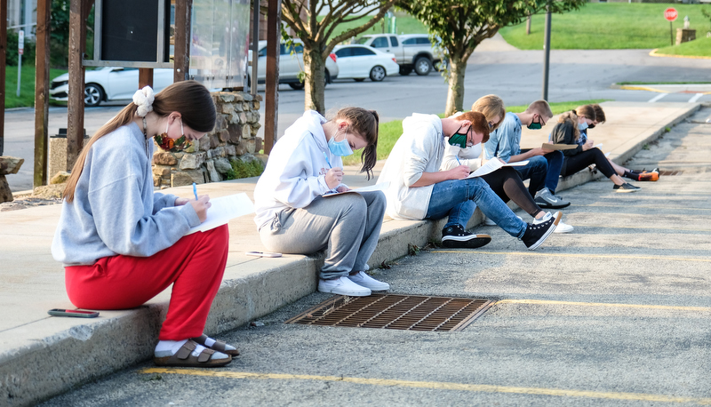 Students filing out forms