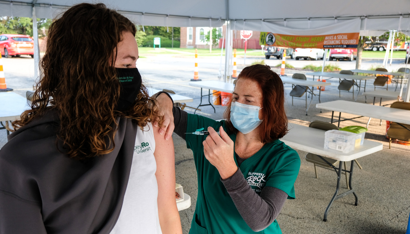 a student receives the vaccine