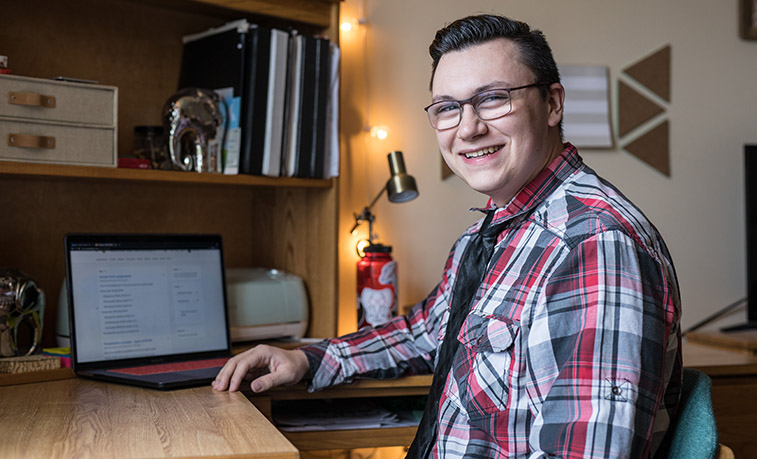 Student in his dorm room