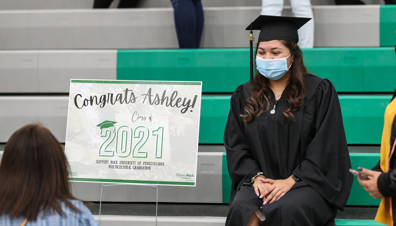 Student poses with her poster
