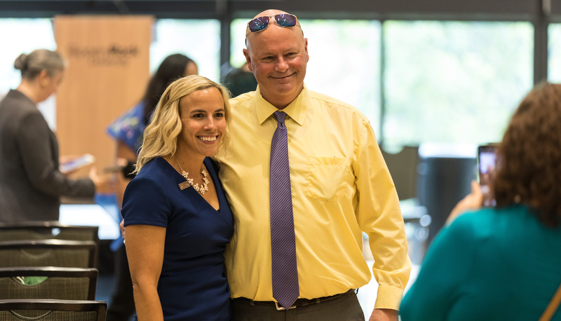 Student celebrating with her father