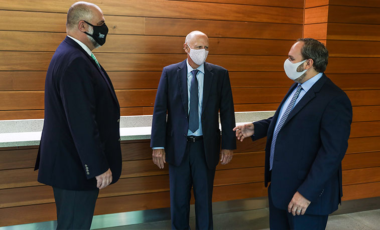 President and Trustee talking wit the newest Dean