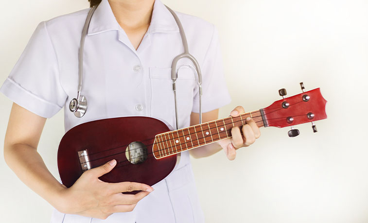 Healthcare worker playing an instrument