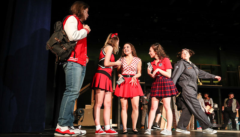 Students performing on stage