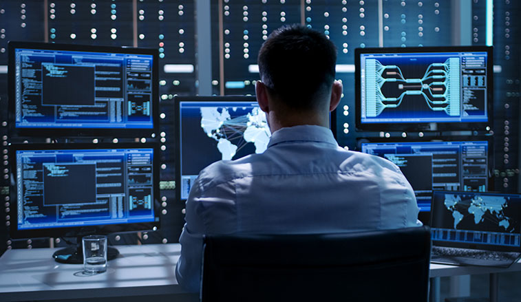 Man sitting behind a computer