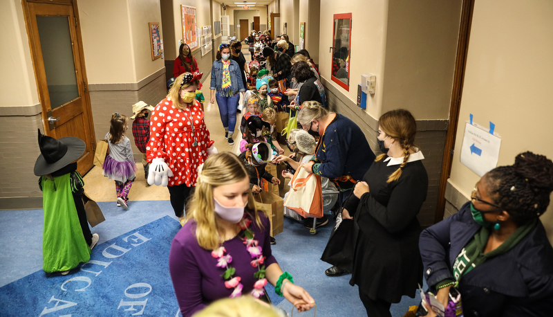 Pre=school students trick or treating in the education building