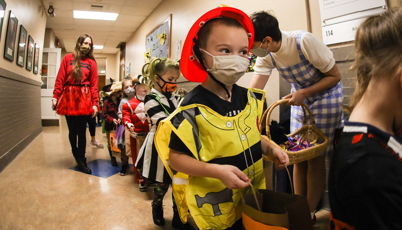 Pre=school students trick or treating in the education building