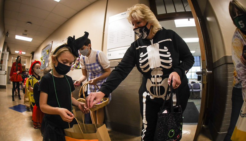 Pre=school students trick or treating in the education building