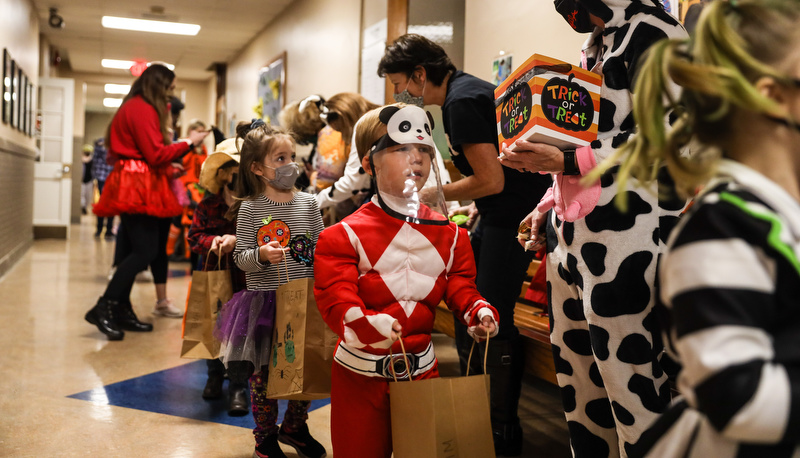 Pre=school students trick or treating in the education building