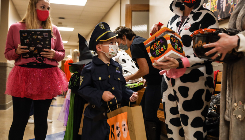 Pre=school students trick or treating in the education building