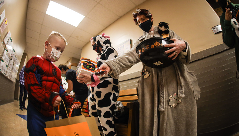 Pre=school students trick or treating in the education building