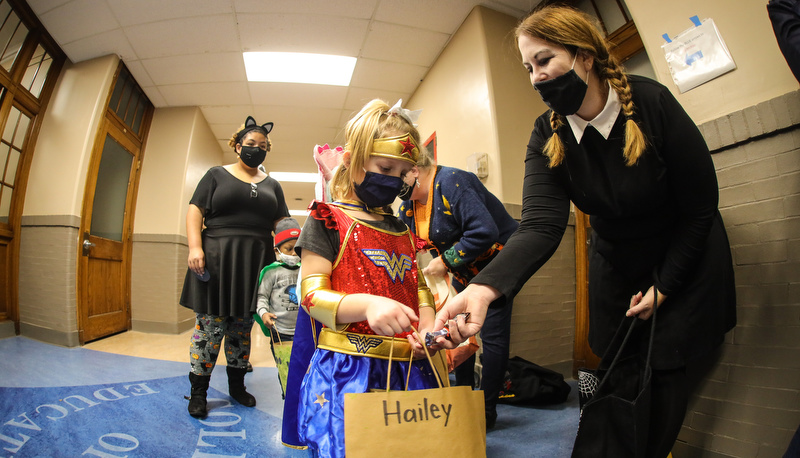 Pre=school students trick or treating in the education building