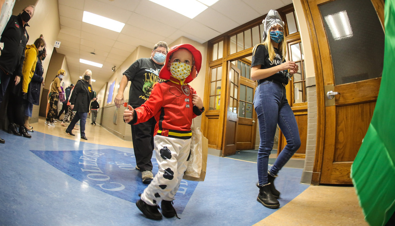 Pre=school students trick or treating in the education building