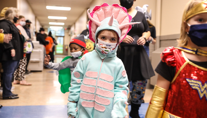 Pre=school students trick or treating in the education building