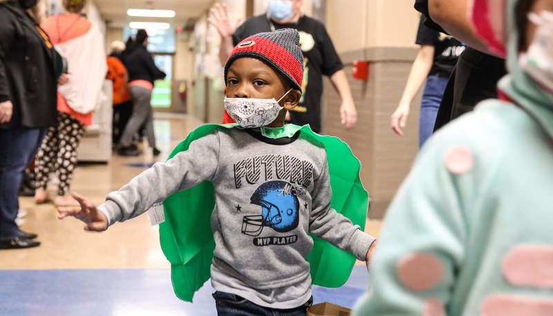 Pre=school students trick or treating in the education building