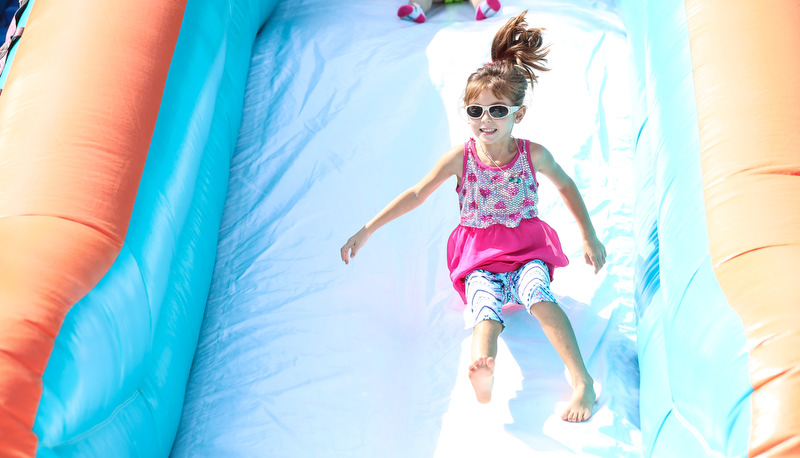 Kid playing on water slide