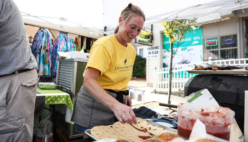 Woman making pizzas