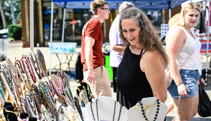 Woman shopping for necklaces