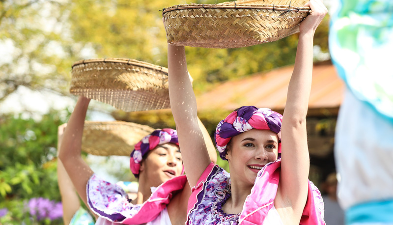 Ladies holding fruit baskets