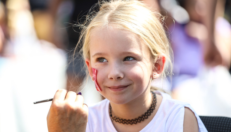 Girl getting her face painted