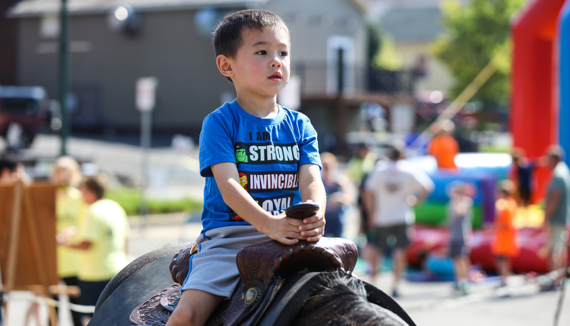 Kid riding a mechanical bull