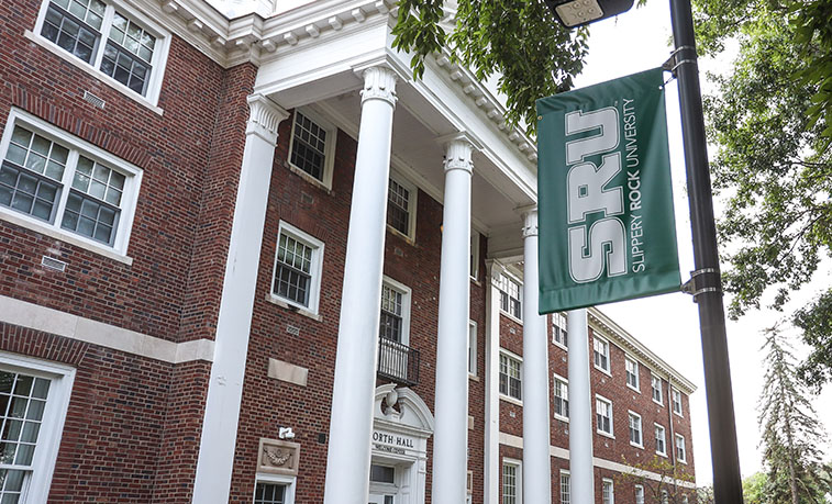 Campus sign in front of North Hall