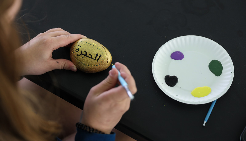 Students painting rocks