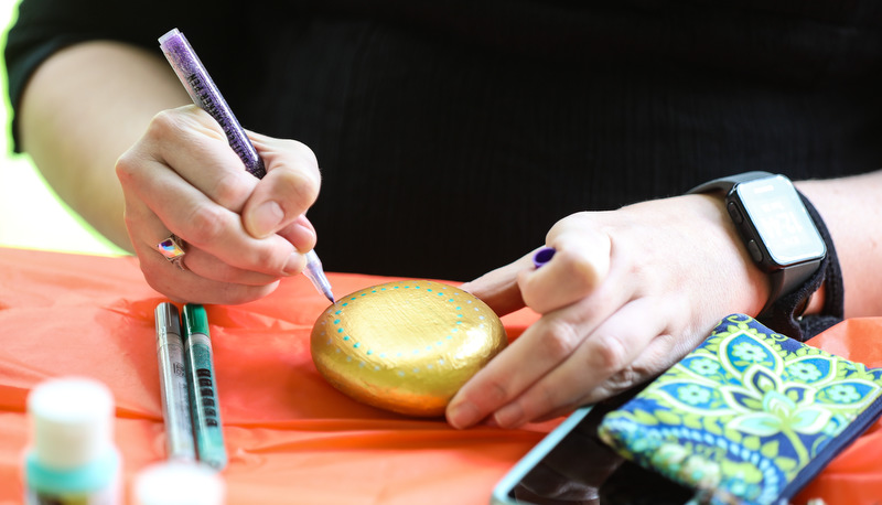 Students painting rocks