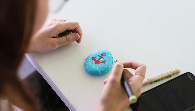 Students painting rocks